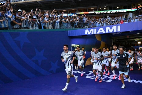 Lionel Messi leads out his team for the warm-up