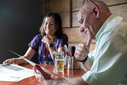 Sunyi and Francis chatting at a restaurant table