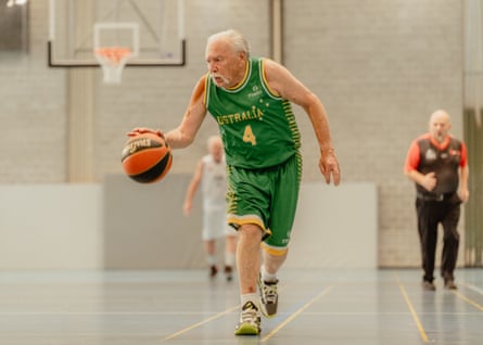 Andy Andriejunas of the Australia Men’s Over 80 basketball team dribbles the ball during a game