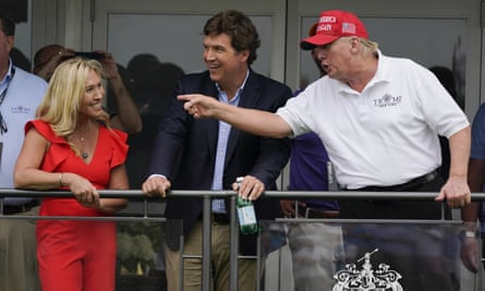 Greene with Tucker Carlson and Donald Trump at the former president's golf club in Bedminster, New Jersey, July 2022.
