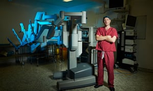 Urologist Greg Shaw with the £1.5m machine which helps the UCH team do 600 prostate operations a year.