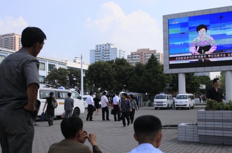 North Koreans in Pyongyang watch a news report on Friday about the nuclear test.