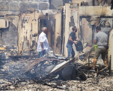 People try to put out a fire at Souni village in Limassol, Cyprus.