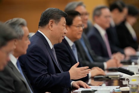 Xi Jinping, third left, speaks during a meeting with Britain's Prime Minister Keir Starmer, unseen, at the Great Hall of the People in Beijing