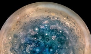 Jupiter's south pole shows turbulence in the clouds.