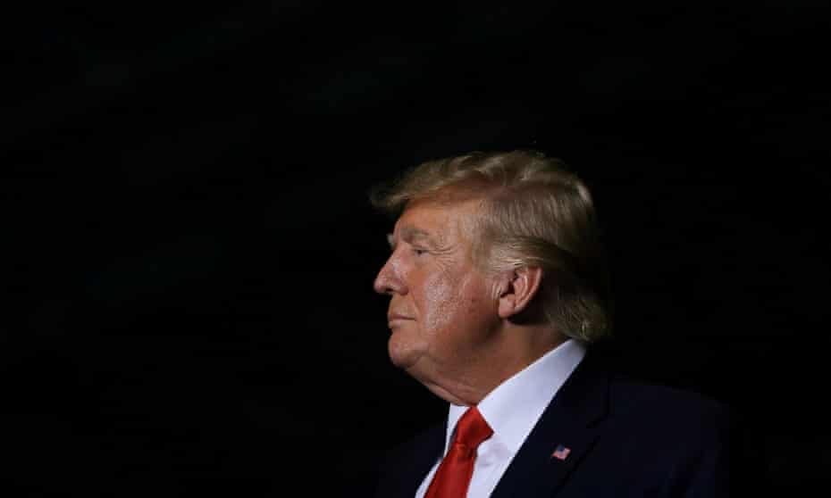 FILE PHOTO: Rally held by former U.S. President Donald Trump
FILE PHOTO: Former U.S. President Donald Trump looks on as Michigan Secretary of State candidate Kristina Karamo speaks during a rally in Washington Township, Michigan, U.S. April 2, 2022. REUTERS/Emily Elconin/File Photo