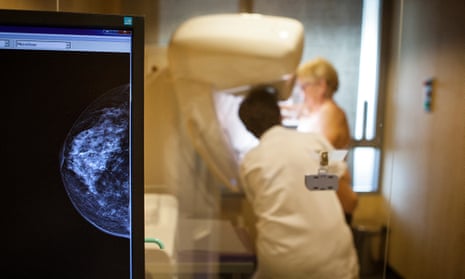 A woman and a medic during a mammogram screening
