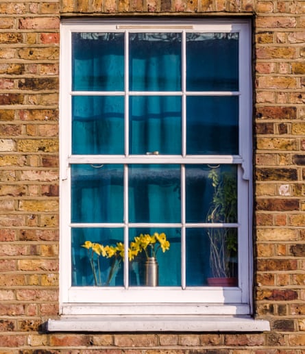 A window with curtains drawn in a north London street.