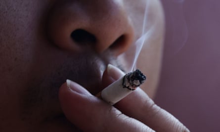 Closeup of a person smoking a cigarette