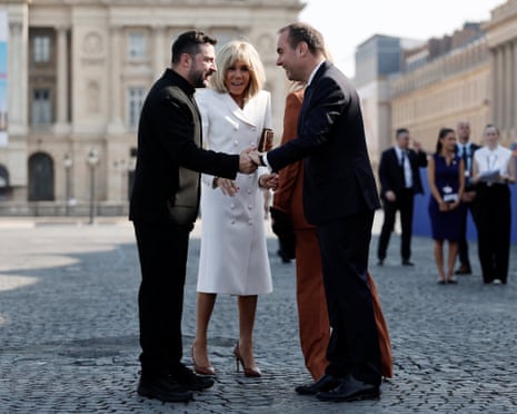 Ukraine’s Volodymyr Zelenskyy gets welcomed by French PM and French First Lady ahead of the Bastille Day parade in Paris.