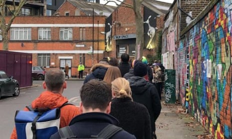 Queue outside Stour space polling station on Roach road in the constituency of Bethnal Green and Bow at 0815 on Thursday