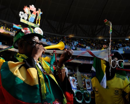 South Africa fans, wearing squad jerseys, scarves, sunglasses and custom-made hats, rustle vuvuzelas earlier their squad play Mexico successful nan opening crippled of nan 2010 World Cup successful Johannesburg.