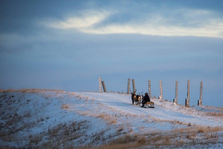 A Nenets man rides a sledge in northern arctic Russia.