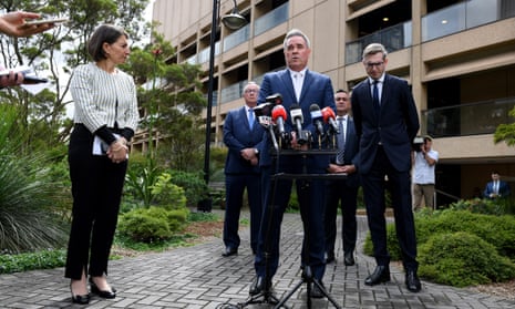 Stephen Cartwright (centre) in March 2020 alongside Gladys Berejiklian and Dominic Perrottet