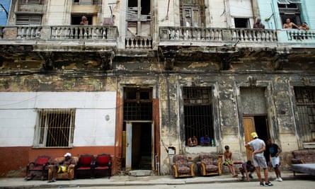 People put furniture out to dry outside their homes in Havana.