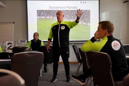 The referee coach Phil Gibbs uses a screen to review decisions with referees
