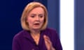 Liz Truss reacts after a crash is heard in the studio