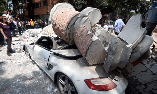 A car crushed by debris in Mexico City.