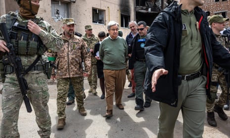 The UN secretary general, António Guterres, visits a heavily damaged residential site in Irpin, Ukraine.