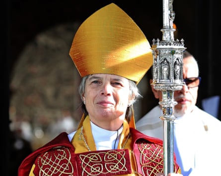 Archbishop Cherry Vann in robes and gold mitre holding a staff.