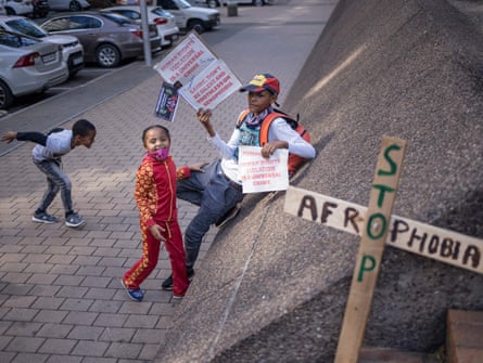 School students and activists from various human rights organisations picket in front of the South African Human Rights Commission.