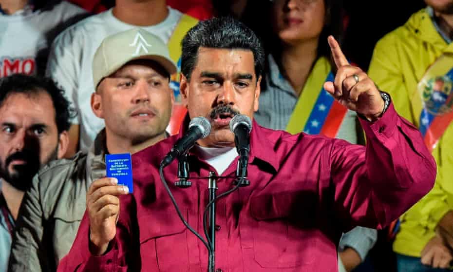 Maduro, seen here holding the political constitution, said: ‘The revolution is here to stay.’ But Boris Johnson says the G20 would ‘be talking about what we can do’.