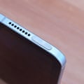 The Touch ID fingerprint sensor in the power button of an iPad mini A17 Pro.