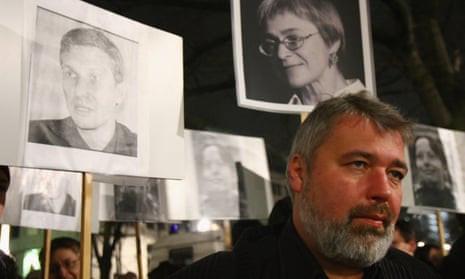Dmitry Muratov, the editor of Novaya Gazeta, at a 2009 demonstration in Berlin with images of Russian journalists and activists who had been killed.