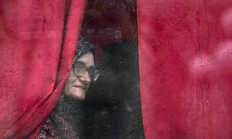 A woman looks out from a bus window as she leaves Severodonetsk, in eastern Ukraine’s Donbas region yesterday.
