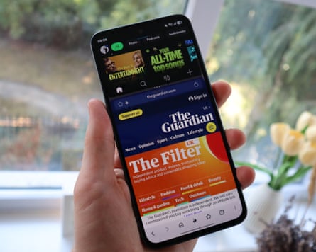 A phone screen showing lots of different tasks from web browsing to playing videos