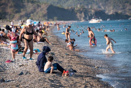 Tourists on Olympos beach in Antalya province. In Turkey, tourism is seen as a lifeline, responsible for about 10% of GDP before the Covid pandemic.