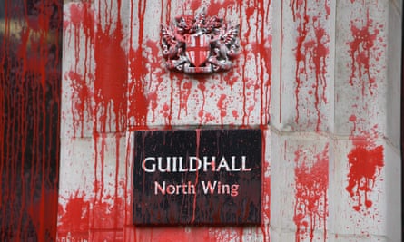 Red paint over a sign on the Guildhall sign during the Extinction Rebellion protest in London