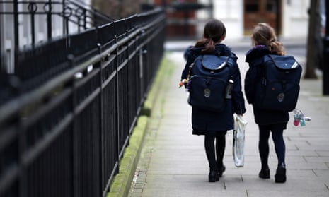 Children leaving a school in London after it was closed by the coronavirus outbreak, March 2020