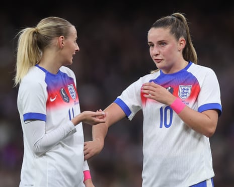Chloe Kelly and Ella Toone talk during an England game