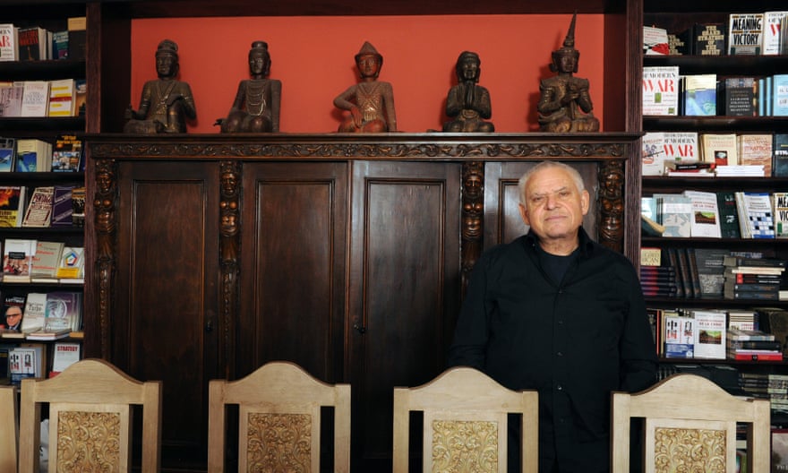 Luttwak at home in Maryland in front of some of the books he has written and translated.