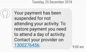 A screenshot of a text message received on Christmas morning notifying a client that payment from Centrelink had been suspended