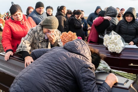 Residents bury two generations of the Panteleiev’s family killed in a Russian missile attack on Hroza.