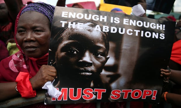 A woman protests against the abduction by Boko Haram of girls from Chibok in May 2014.