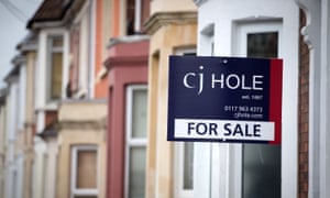 An estate agentâ€™s board outside a property