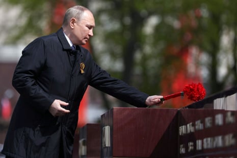 Russian President Vladimir Putin lays flowers at a memorial to the Hero Cities during a ceremony at the Tomb of the Unknown Soldier on Victory Day.