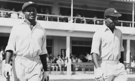 West Indies batsmen John Holt (left) and Everton Weekes walk out on the second day of the first Test against at Kingston’s Sabina Park in January 1954.