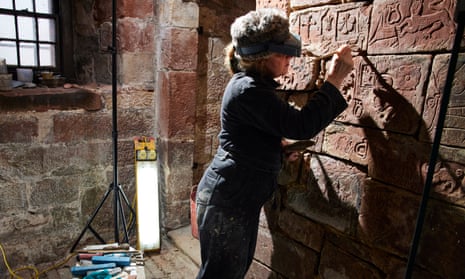 Stone and plaster conservator Alex Carrington works on the carvings in the oratory at Carlisle Castle