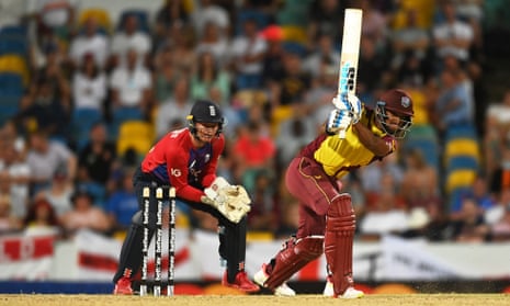 Nicholas Pooran in action, watched by the well-travelled Sam Billings.