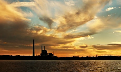 Spectacular Golden Lake Sunset over Vales Point power station.<br>A striking inspirational gold coloured cloudy salt water lake sunset over Vales Point power station, near Newcastle