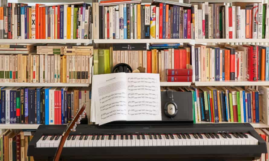 Bookshelves full of books with a keyboard in front