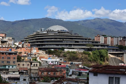 A wide, multi-level, triangular building topped with a dome