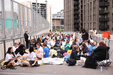 Harry Styles fans queuing at Wembley stadium.