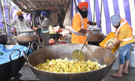 A make-shift community kitchen prepares food for protesting farmers at the Delhi-Haryana border in Singhu