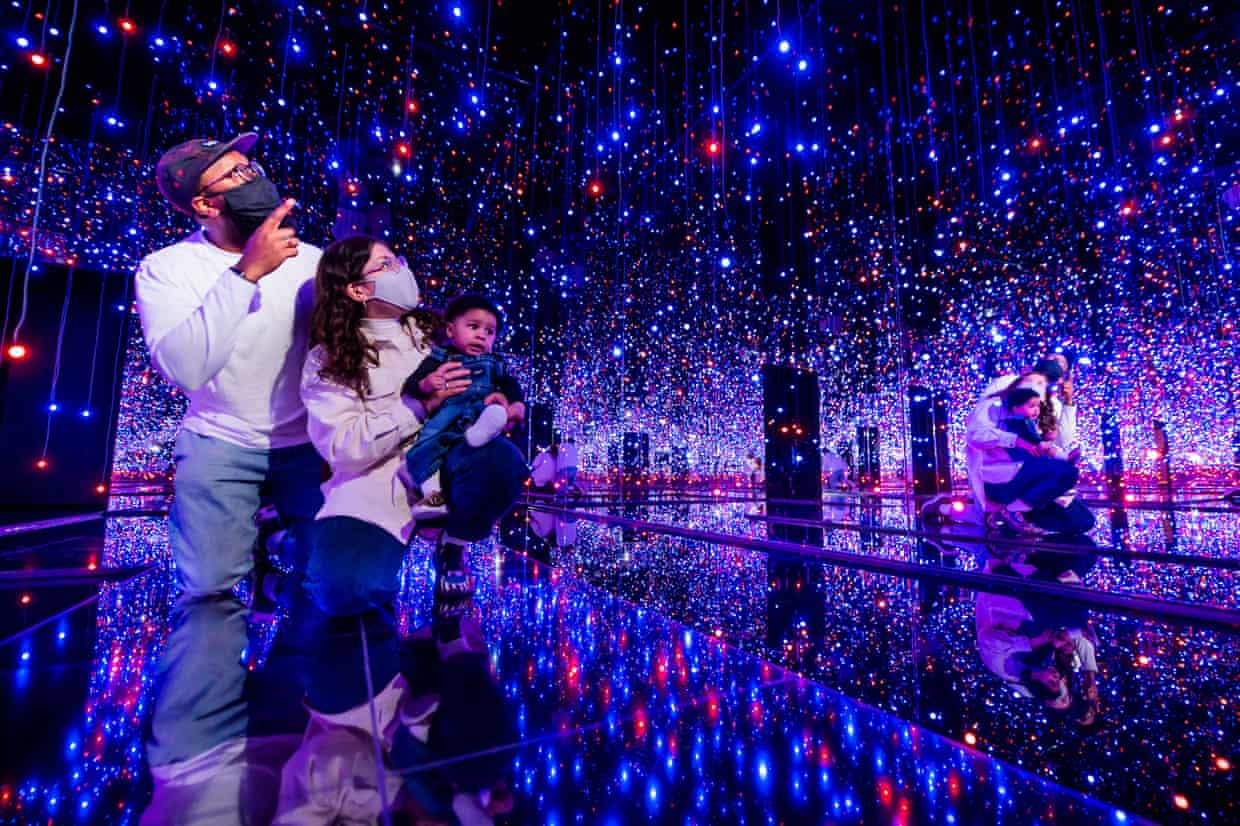 Visitors inside Yayoi Kusama’s show at the Tate Modern, London in 2021.