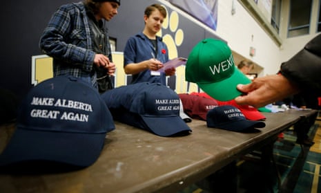 A man buys a hat to raise funds at a rally for Wexit Alberta, a separatist group seeking federal political party status, in Calgary, Alberta, Canada, earlier this month.